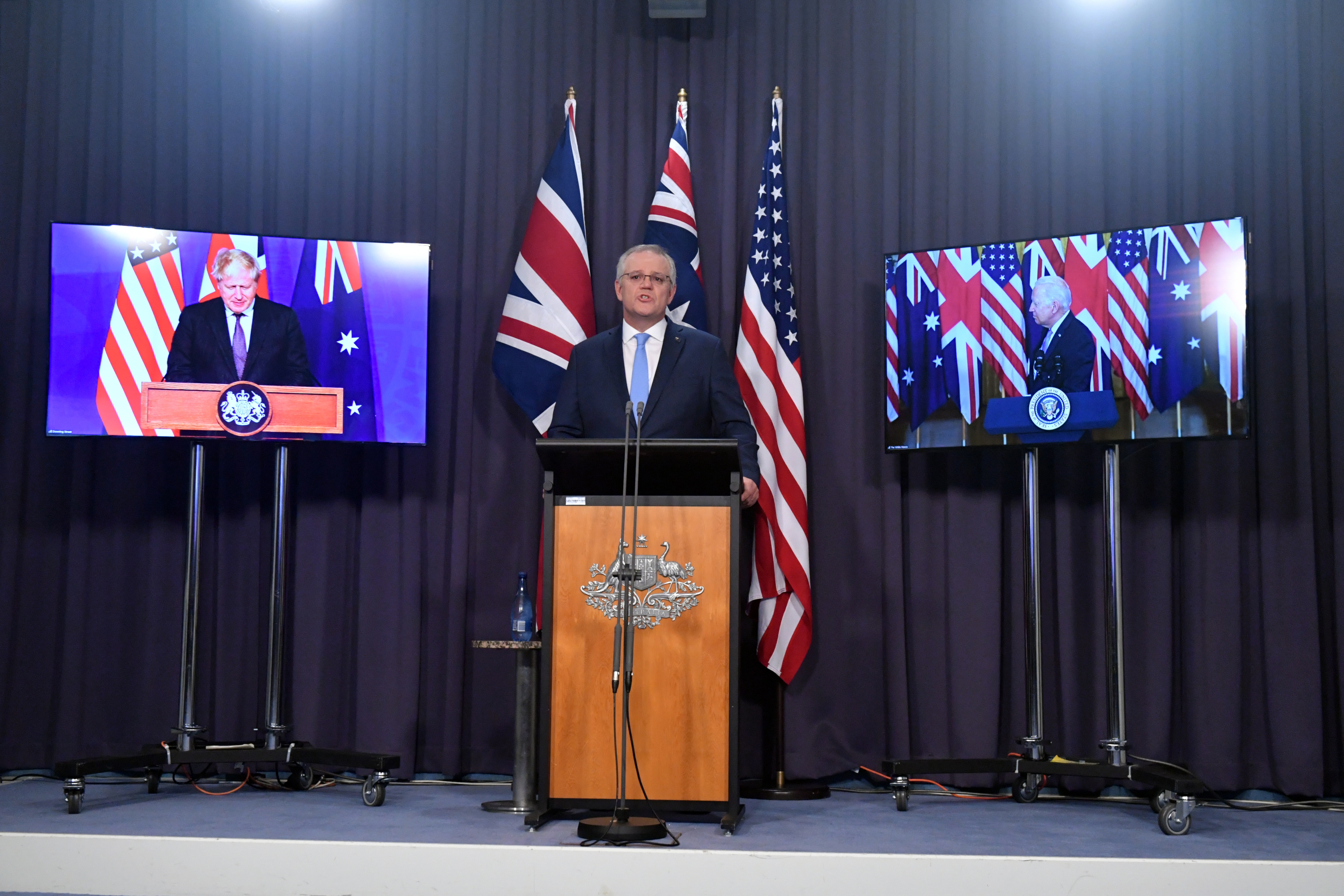 Britains Prime Minister Boris Johnson, Australia's Prime Minister Scott Morrison and US President Joe Biden at a joint press conference in Canberra. 