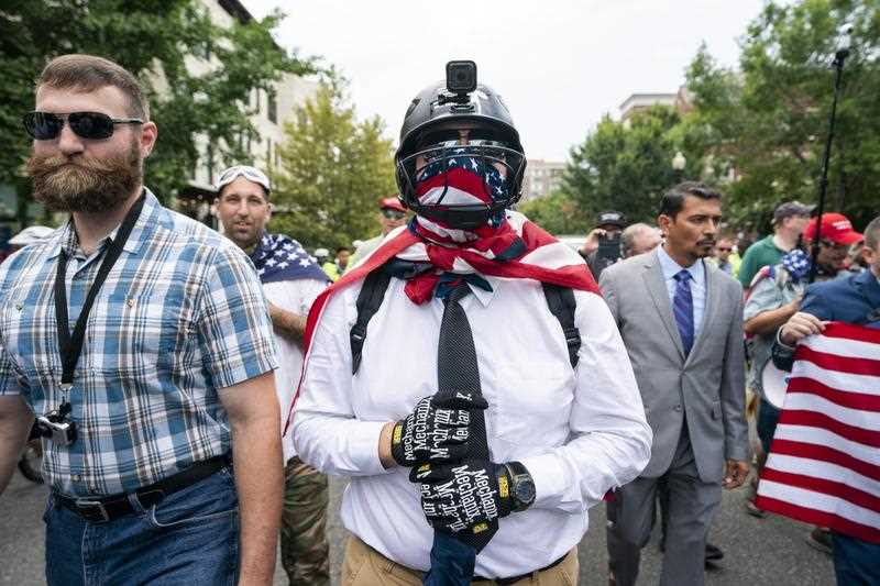 White supremacists and members of the alt-right march to the White House on the anniversary of last year's 'Unite the Right' rally in Washington, DC