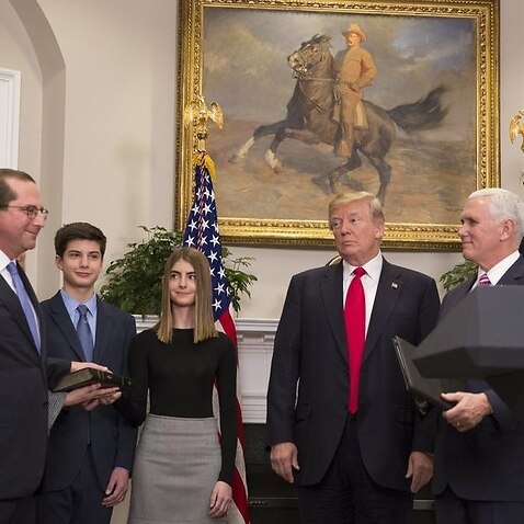 US President Donald Trump looks on as Alex Azar is sworn in