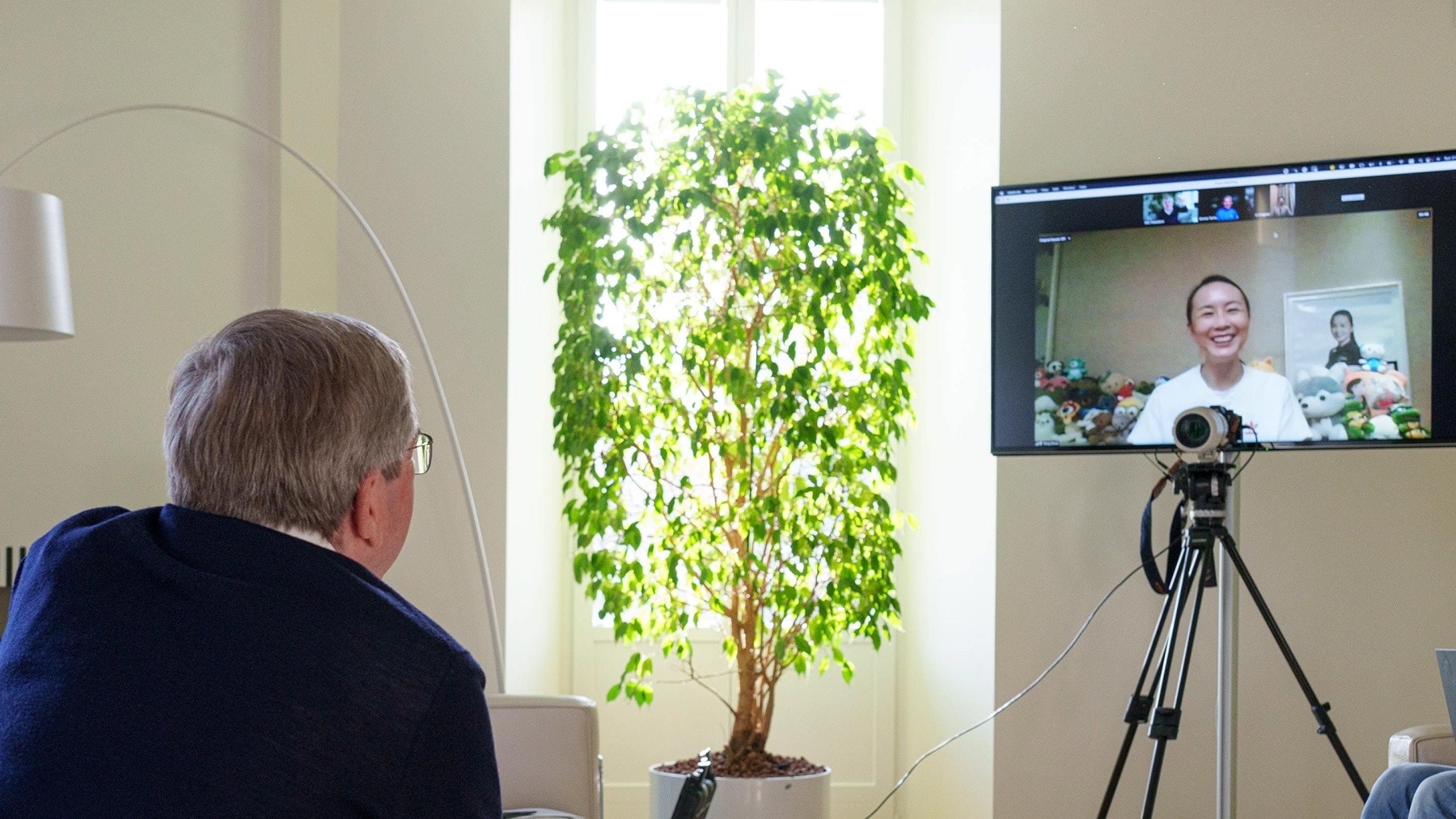 An IOC handout photo shows IOC President Thomas Bach on a video call with  Peng Shuai.