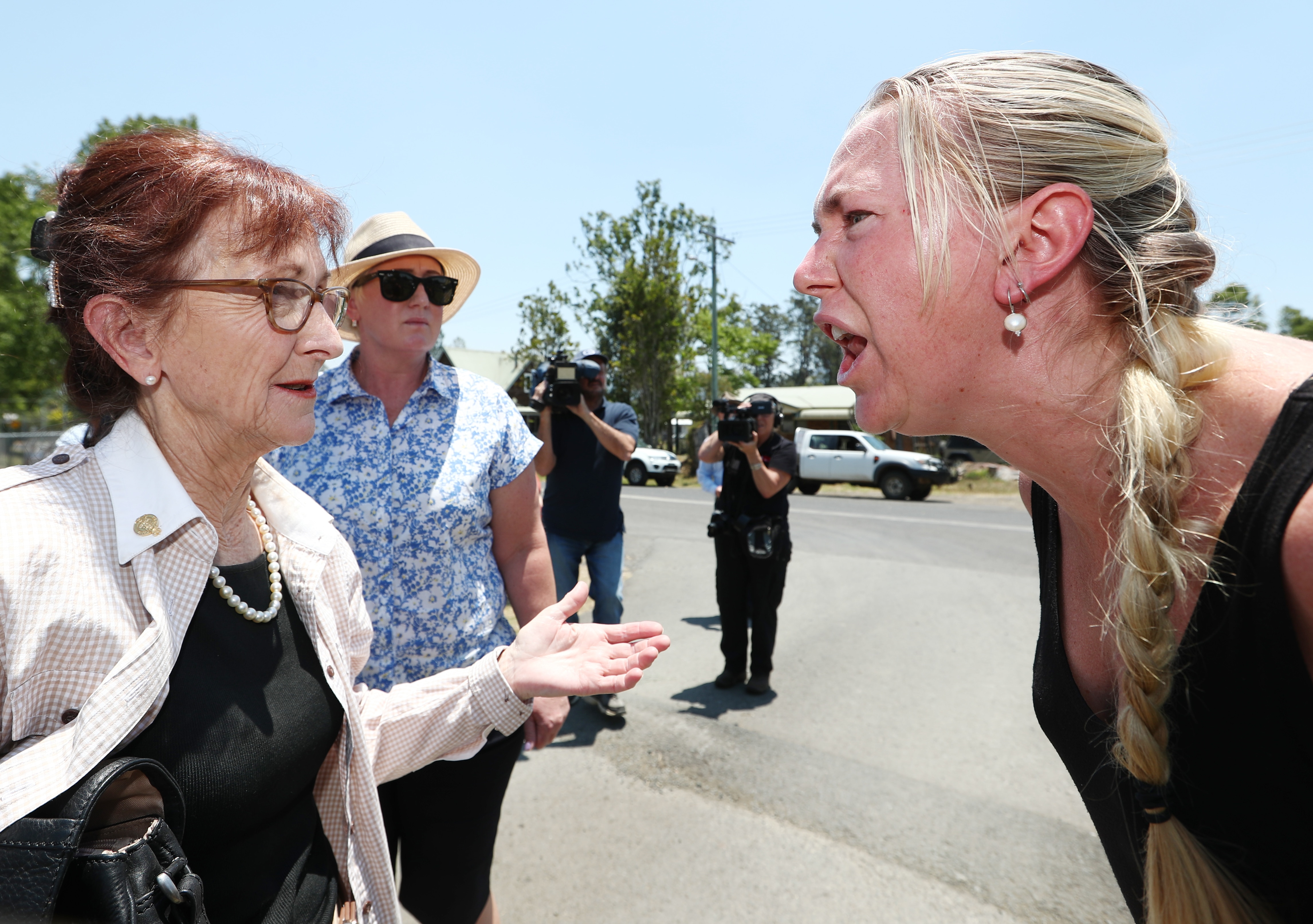 Local resident Ginger O'Brien shouts at Lismore MP Janelle Saffin.