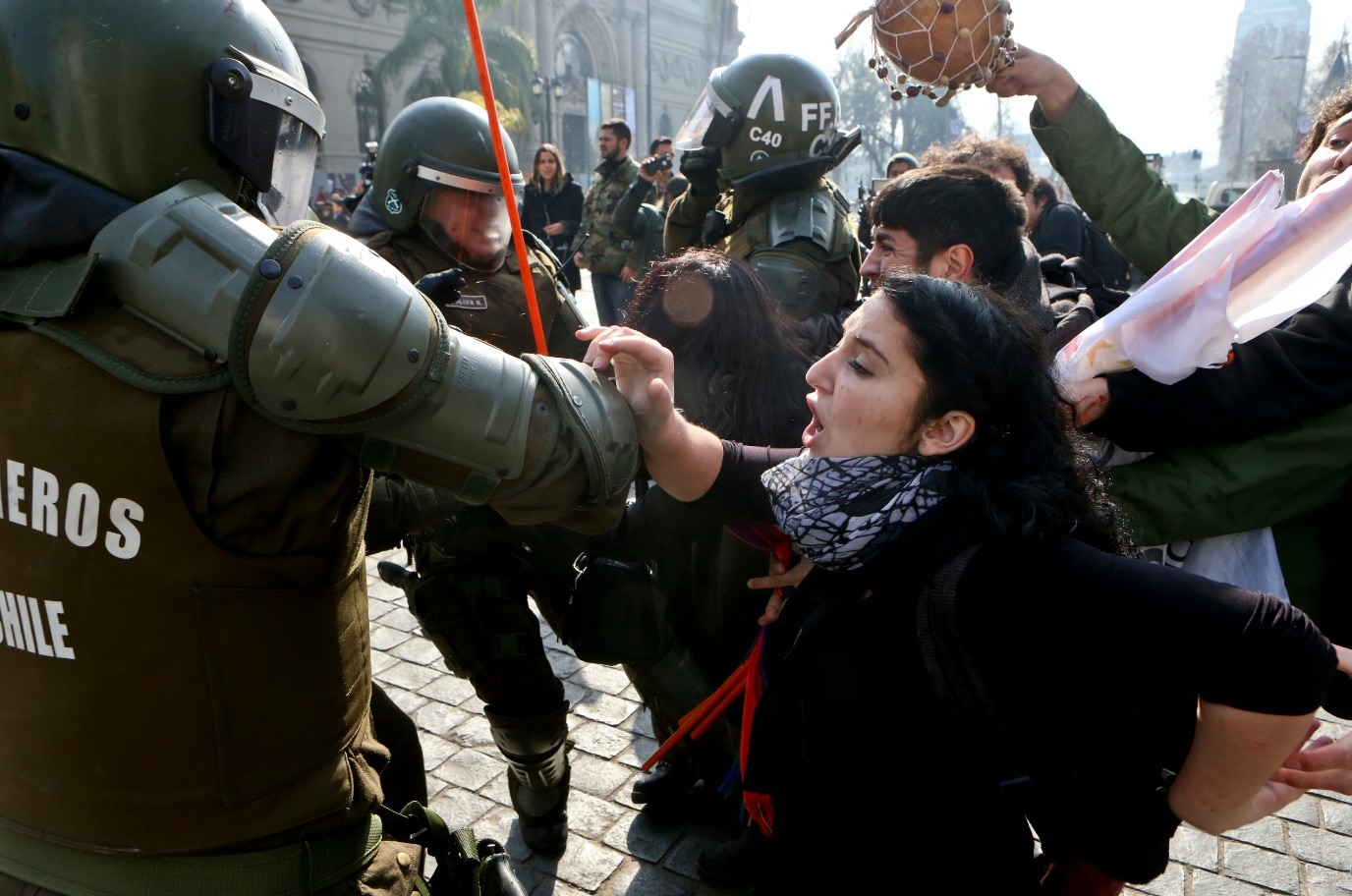 People protesting against of the self-proclaimed People protesting against of the self-proclaimed "Bus of freedom," which rejects transgender children in schools, clashes with police in downtown Santiago (AAP)