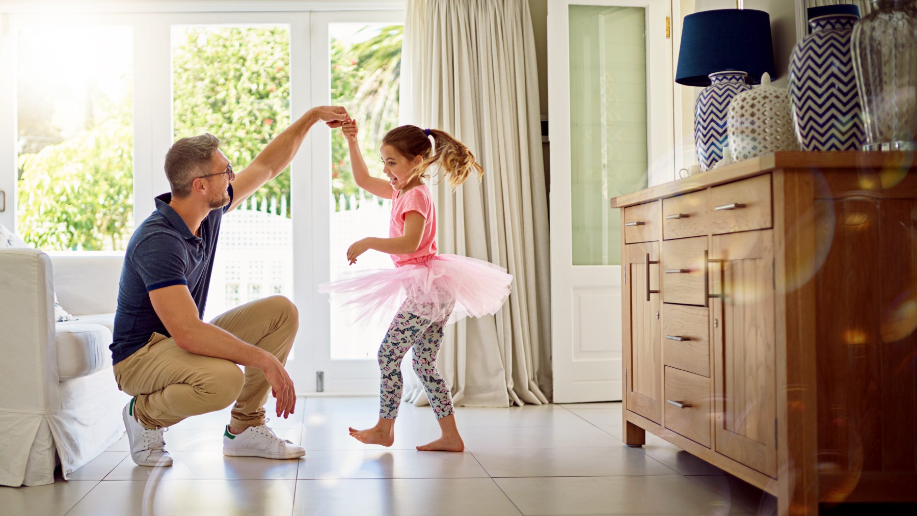 Dad teaching his daughter to dance