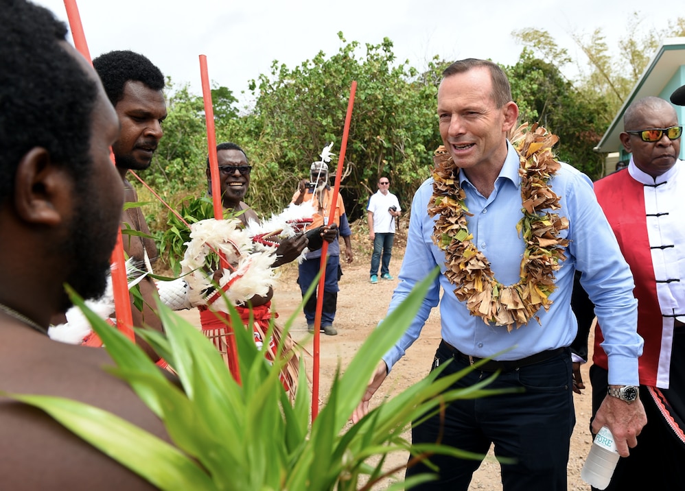 Tony Abbott visiting the grave of land rights activist Eddie Mabo on Mer Island in the Torres Strait.