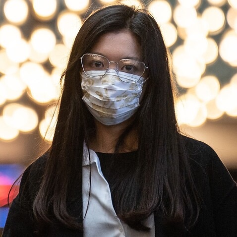 A woman wearing a face mask in Sydney in March
