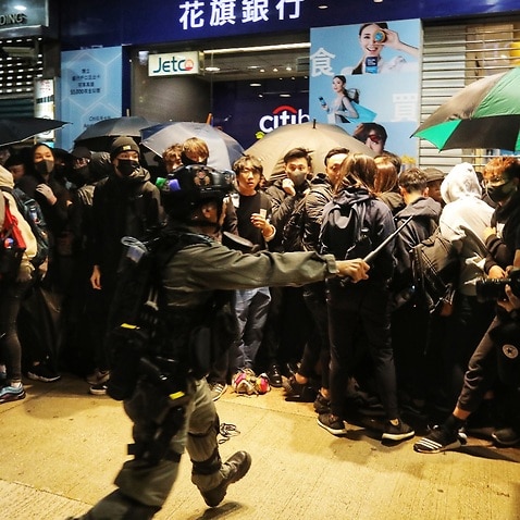 Riot police detain protesters during an anti-government rally on New Year's Day in Hong Kong.