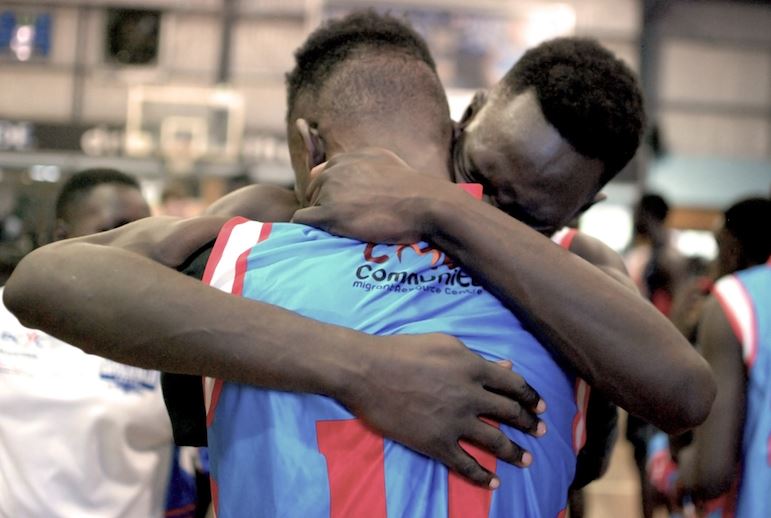 Two players hug following an earlier Summer Slam match.