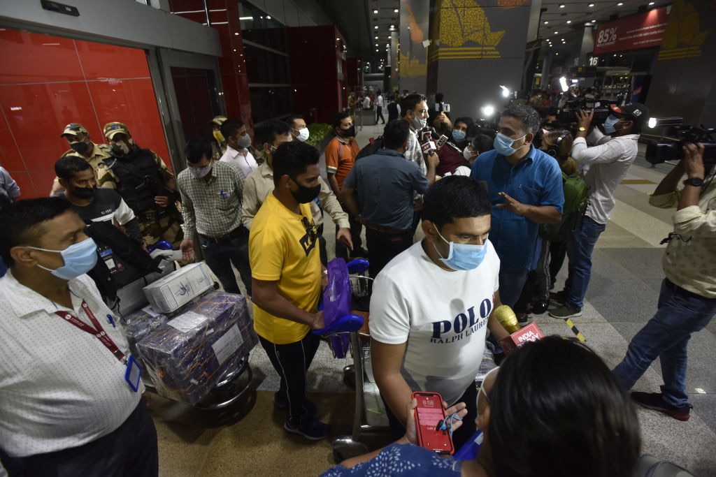 Passengers from Kabul arrive at Delhi's Indira Gandhi International Airport.