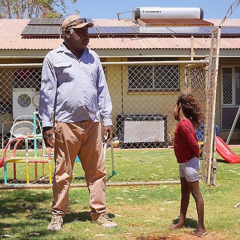 Norman Frank in front of his Tennant Creek home. His local energy provider isn’t able to connect the solar panels on his roof to the grid, making them functionally useless     
