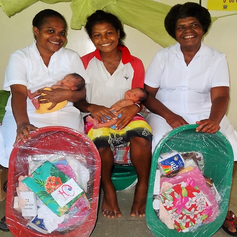 Mothers with Baby Bundles in Papua New Guinea