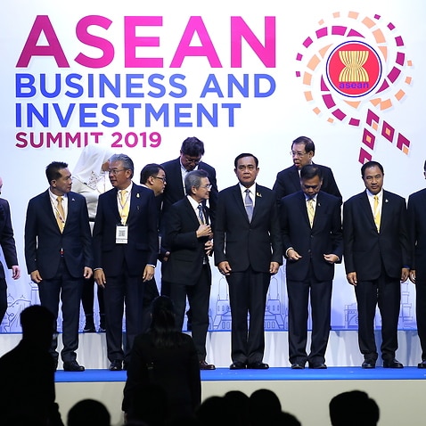 Thailand's Prime Minister Prayut Chan-o-cha (C) poses for a group photo with attendees during the opening ceremony of ASEAN Business and Investment Summit 2019.