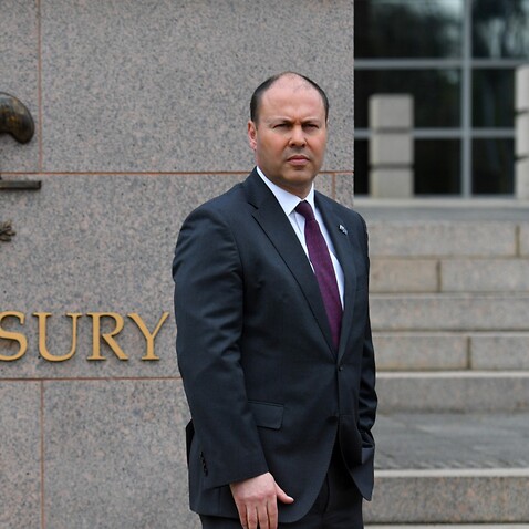 Treasurer Josh Frydenberg poses for photographers during a media opportunity outside The Treasury in Canberra. Monday, October 5, 2020. 