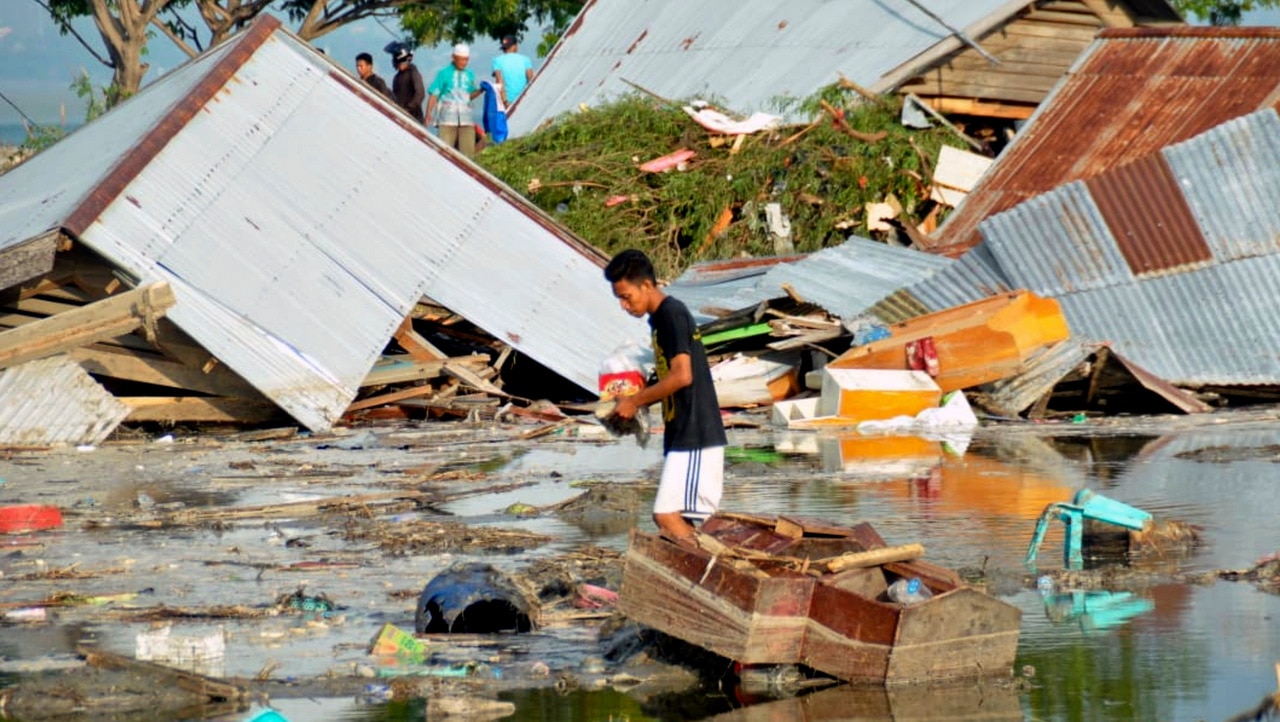 A man reviews the damage caused by the earthquake and tsunami in Palu, central Sulawesi, Indonesia.