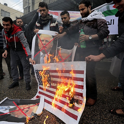 Two Palestinians killed and scores wounded in 'day of rage' over Trump ...