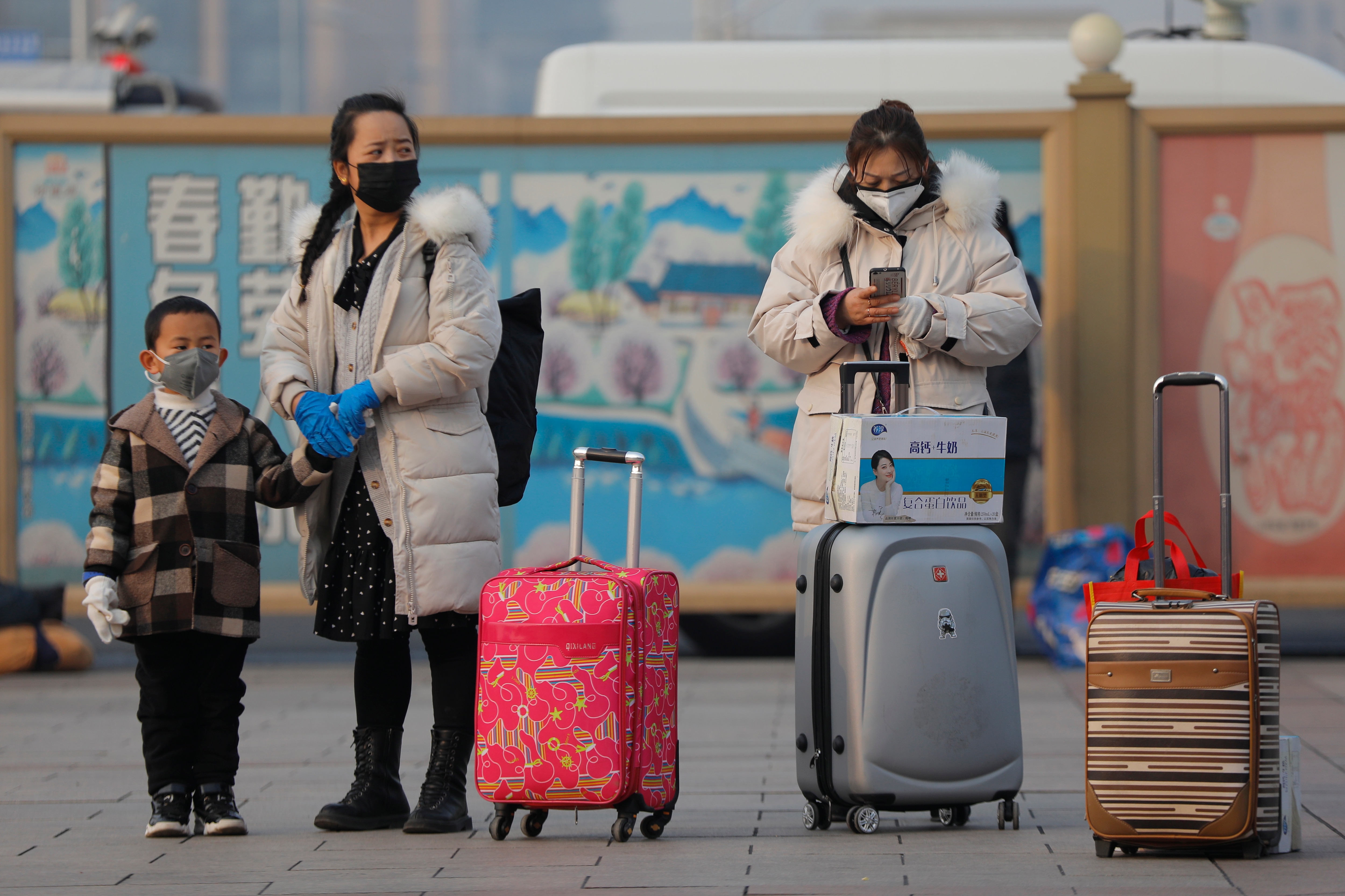 Passengers wearing protective masks at Beijing railway station in Beijing, China.