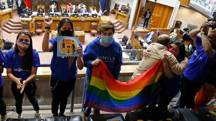 Members of different social movements celebrate in the Senate after the passing of a bill to legalize same-sex marriage in Chile, 7 December, 2021.