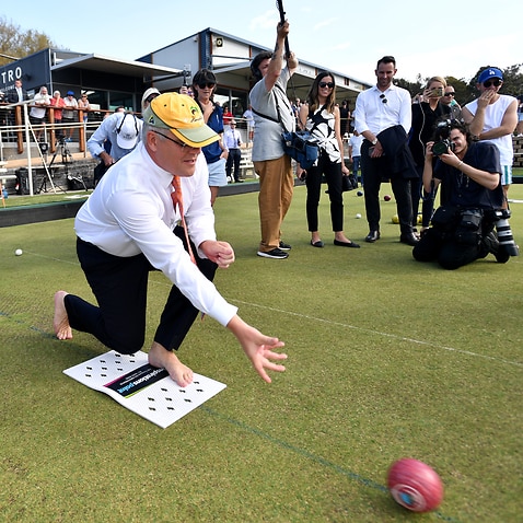Prime Minister Scott Morrison and Liberal member for Corangamite Sarah Henderson play bowls at the Torquay Bowls Club near Geelong, Tuesday, April 16, 2019. (AAP Image/Mick Tsikas) NO ARCHIVING