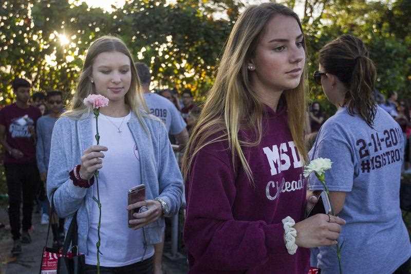Students were greeted by supporters, signs and flowers as they returned to category during Marjory Stoneman Douglas High School.