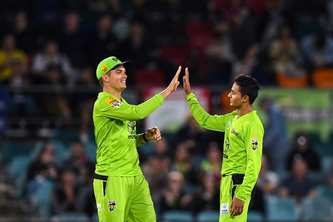 Tanveer Sangha celebrates after winning the BBL  match between the Sydney Thunder and Melbourne Renegades at Manuka Oval, Canberra, Saturday, Dec 26, 2020. 