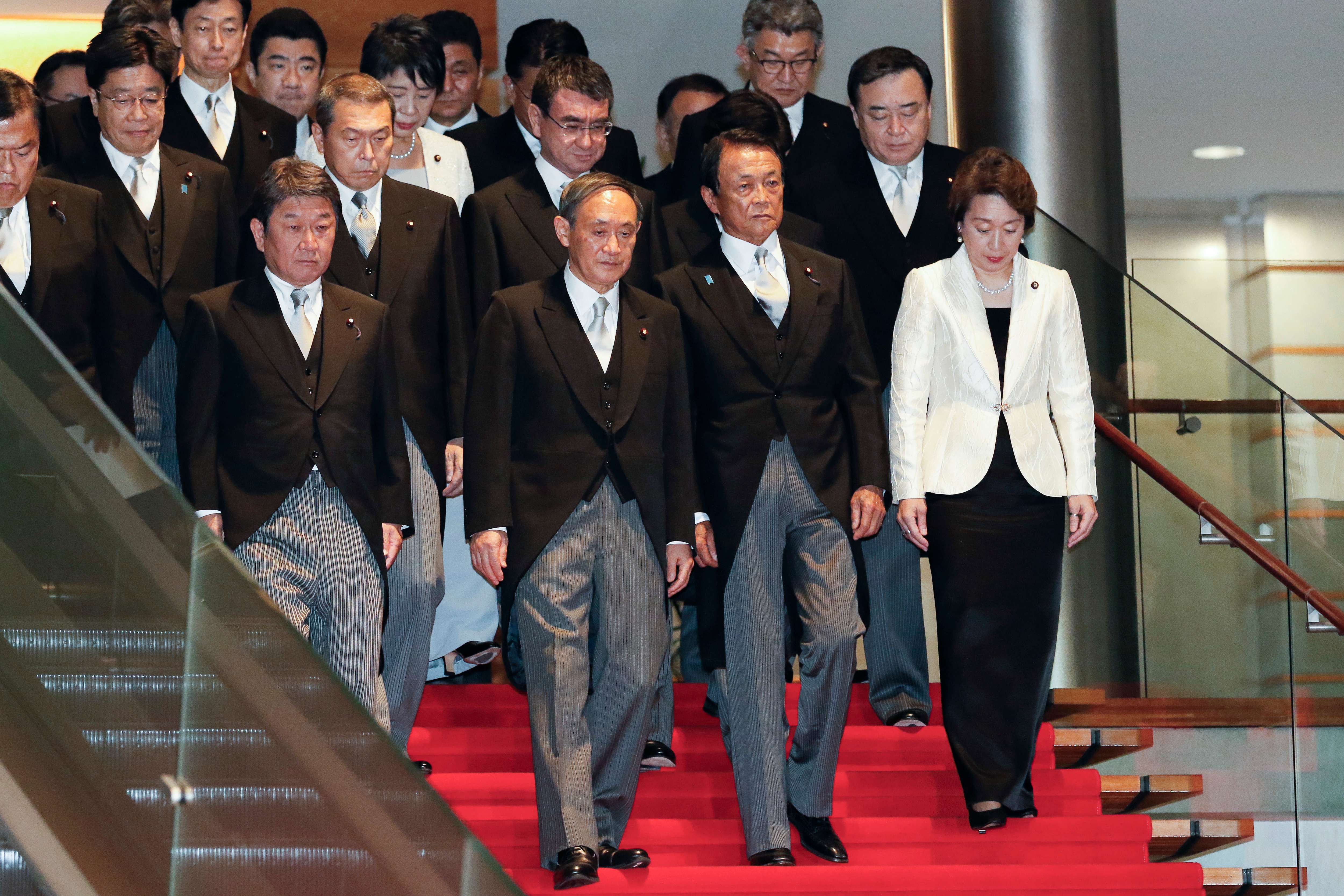 Prime Minister Yoshihide Suga (front row center) and his new cabinet members.
