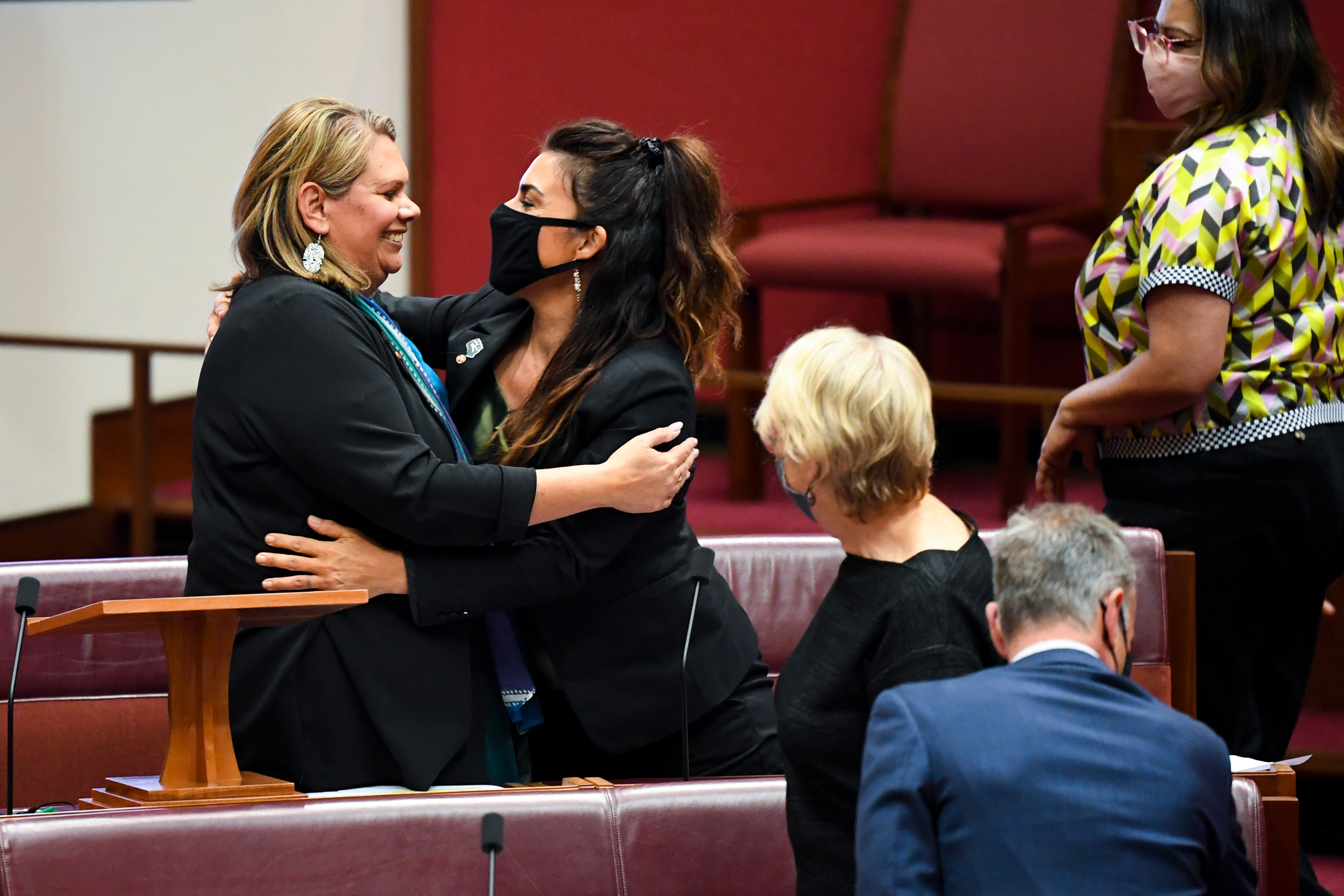 Greens Senator Dorinda Cox is congratulated after delivering her maiden speech.