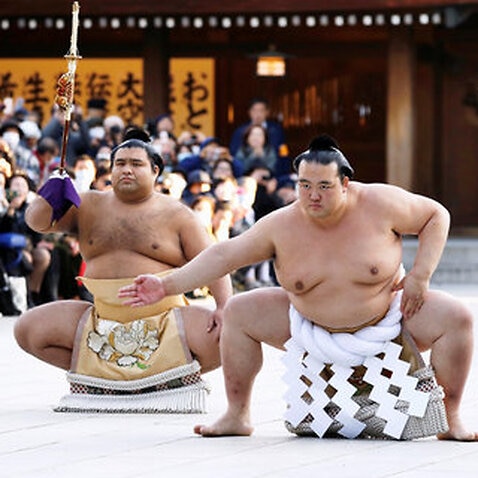Fans cheer Japan's new sumo champion at stomping ceremony