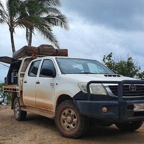 Recreational vehicle seen next to beach site