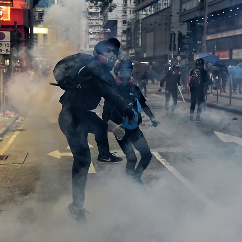 Protesters in action after the police fired tear gas during a pro-democracy rally in Hong Kong.