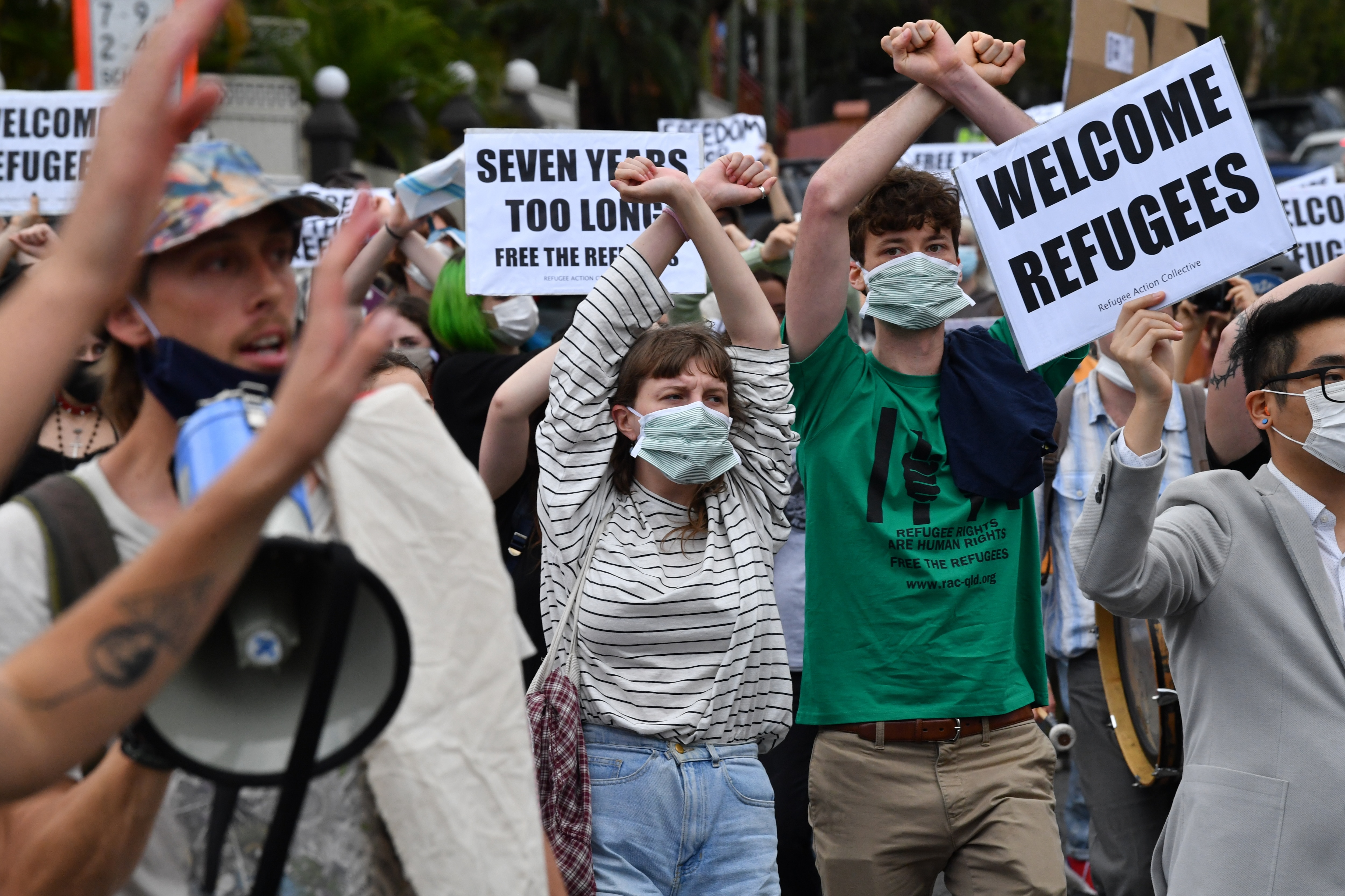 Protesters are seen during a rally in support of asylum seekers detained at the Kangaroo Point Central Hotel in Brisbane, Saturday, August 15, 2020.