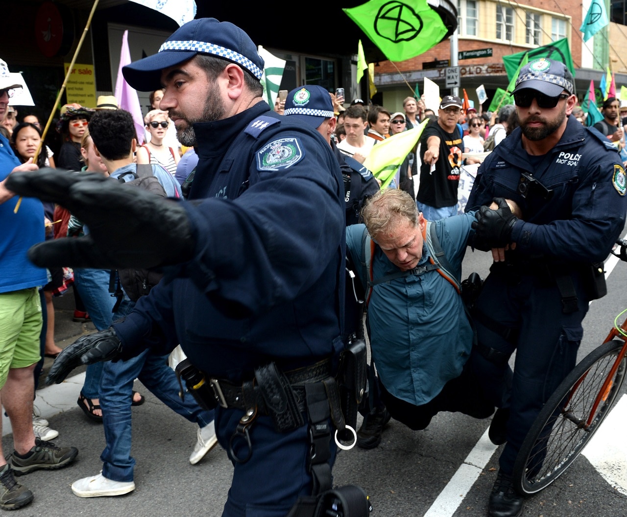 Protesters are removed and arrested during an Extinction Rebellion protest in Sydney.