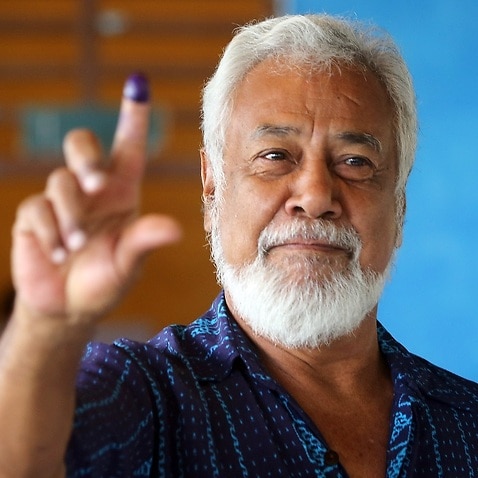 Former president and leader of the the National Congress for Timorese Reconstruction (CNRT) Xanana Gusmao shows his inked finger.