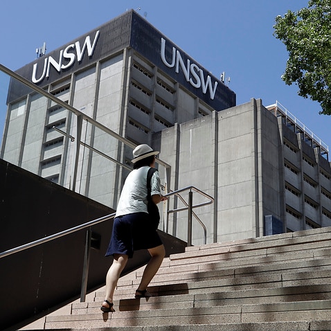 A student walks around the University of New South Wales campus in Sydney, Australia