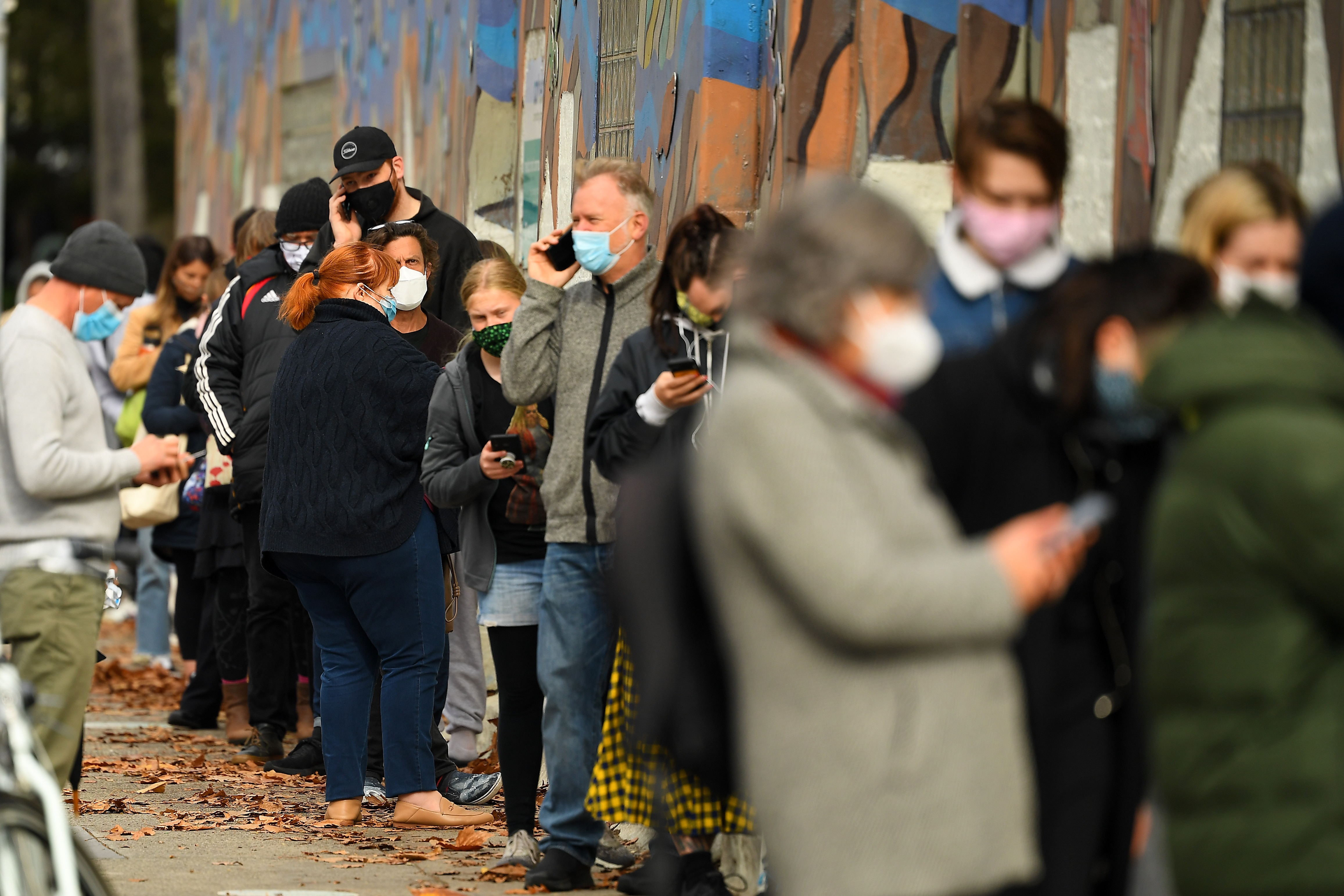 People are seen waiting in a line to receive covid19 tests at a walk-in covid19 testing facility in Melbourne, Wednesday, May 26, 2021. 