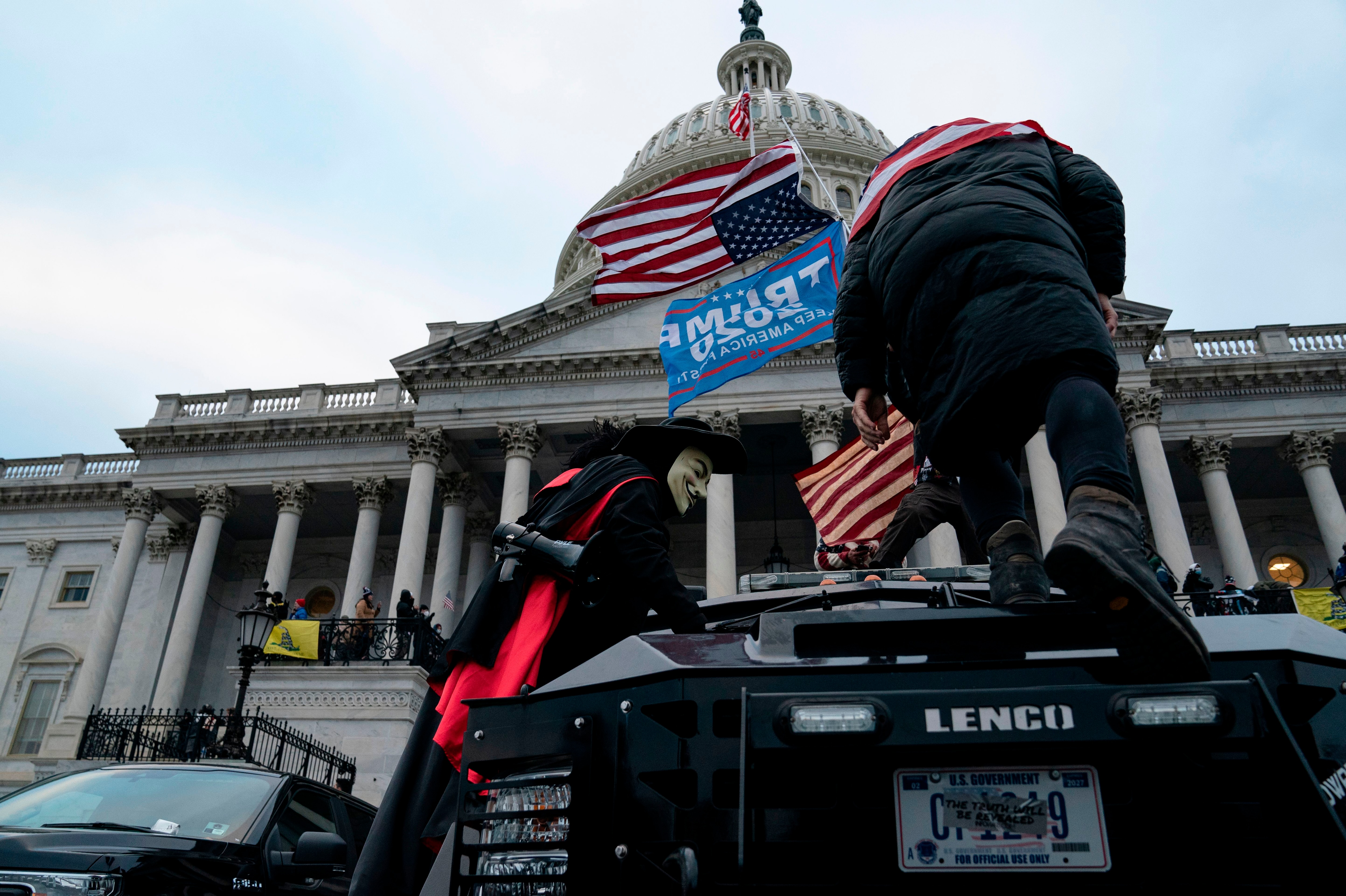 An upside-down American flag, a symbol for national distress, is flown outside the US Capitol during the riots.