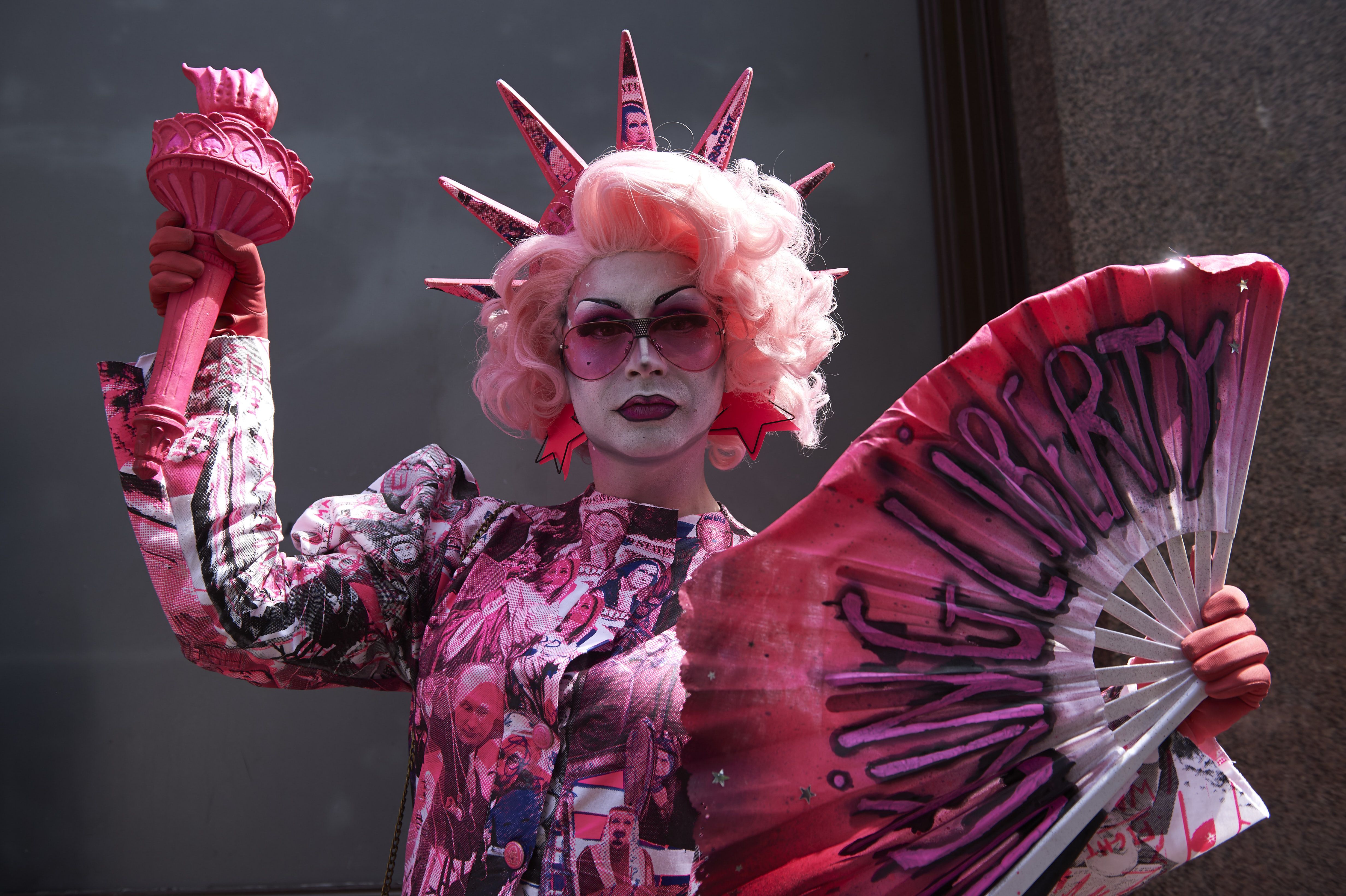 A drag queen joins protesters against the UK visit of US President Donald Trump as they gather to take part in a march and rally in London on July 13, 2018. A drag queen joins protesters against the UK visit of US President Donald Trump