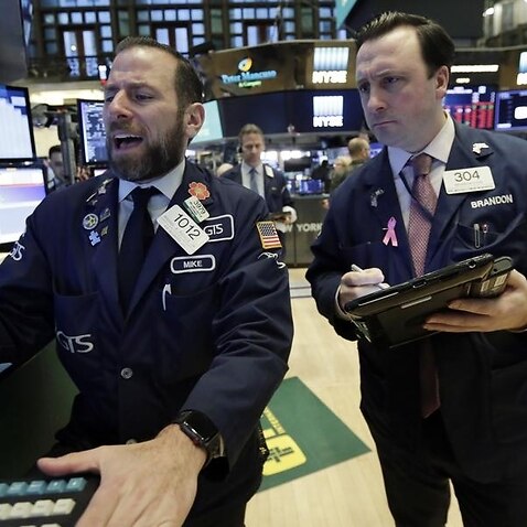 Brokers on the floor of the New York Stock Exchange.