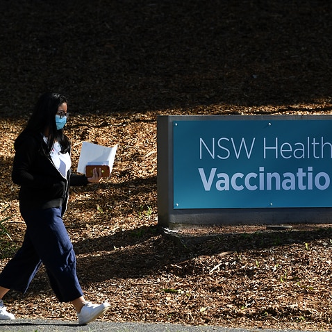 An unidentified person at a COVID-19 vaccination hub in Sydney. 