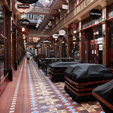 Empty cafe seating areas are seen at the Strand Arcade in Sydney during lockdown.