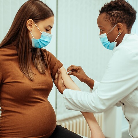 A pregnant woman receiving coronavirus jab