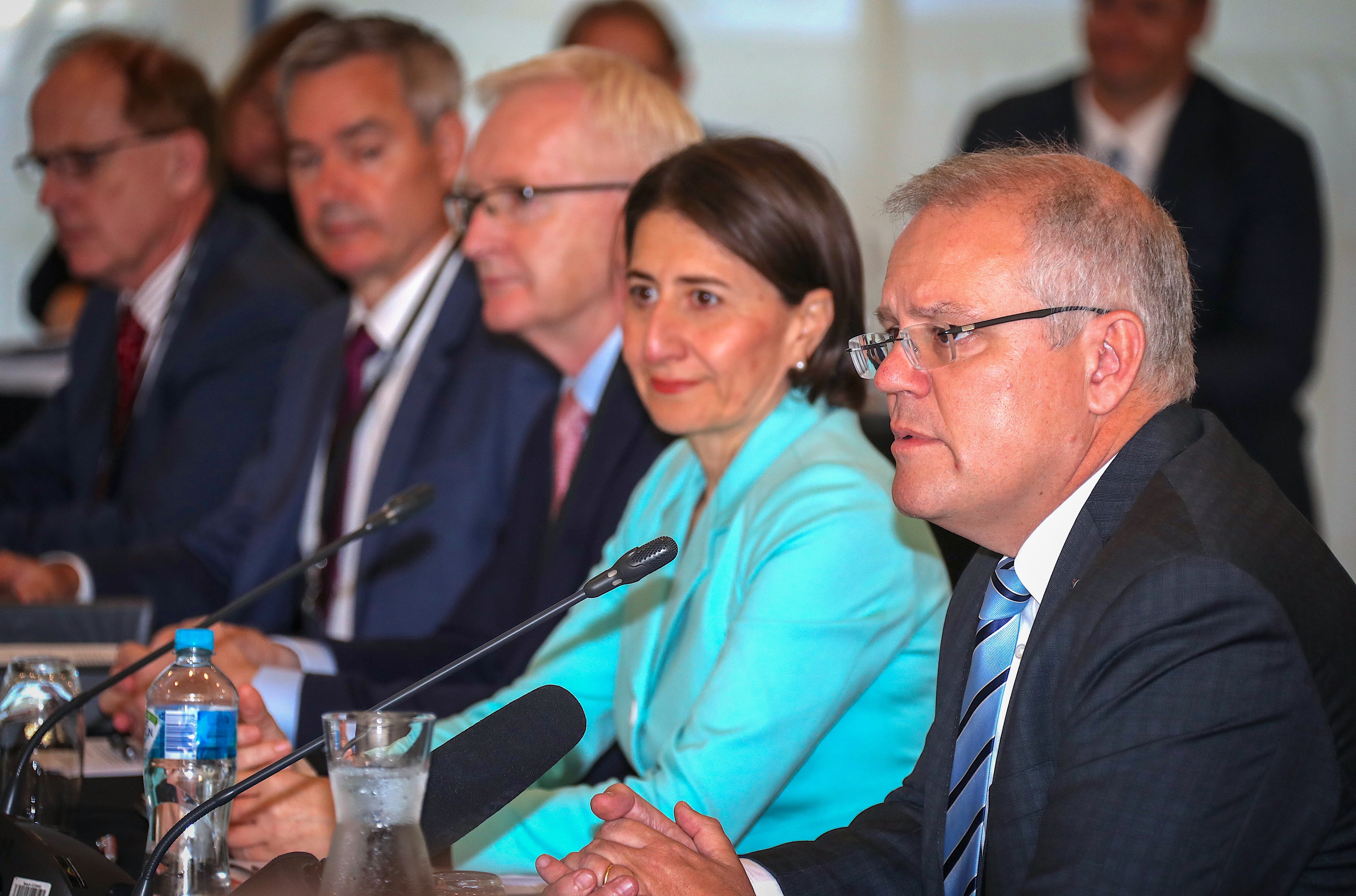 NSW Premier Gladys Berejiklian (second from right) listens as Australian Prime Minister Scott Morrison (right) speaks during the COAG meeting in Sydney.