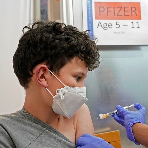 A kid in the U.S. gets the first shot of the Pfizer COVID-19. 