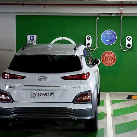 A Hyundai KONA Electric at a EV charge station in Crows Nest, Sydney. Rideshare company Uber is cutting service fees for some drivers who use electric vehicles.