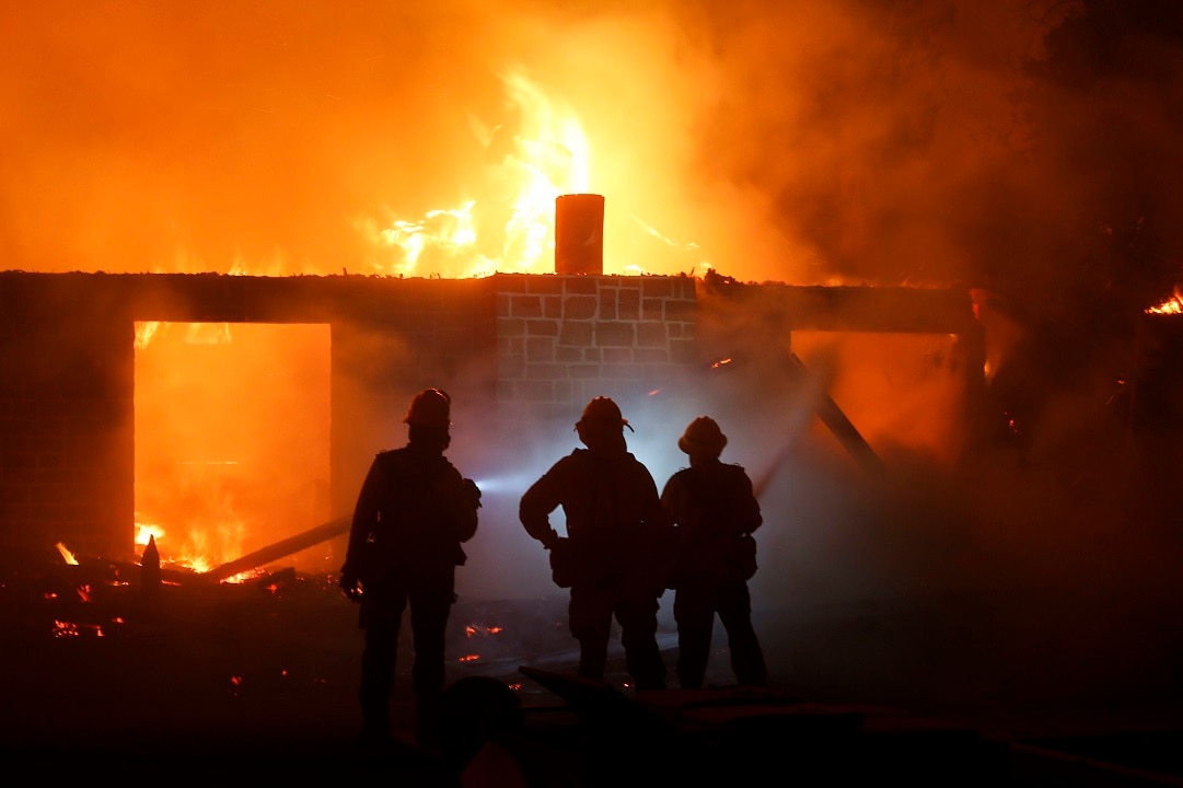 California's firefighters still demand nine lives and force tens of thousands of people to flee.