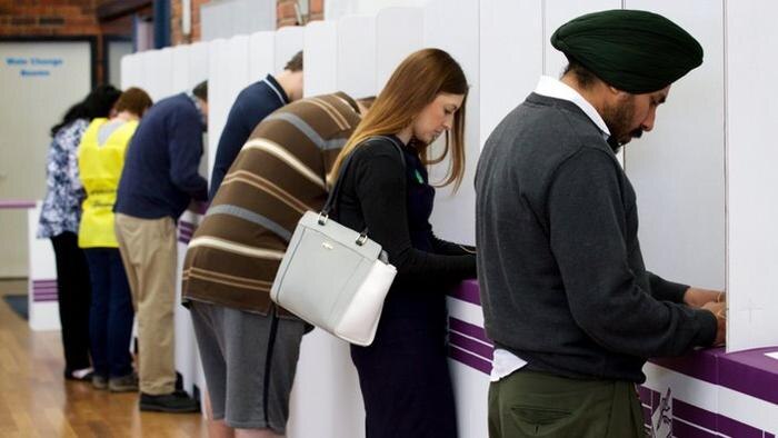 Members of the public casting their vote at Kelmscott Senior High School on election day of the Canning by election in Kelmscott, Western Australia on Saturday Sept. 19, 2015. (AAP Image/Richard Wainwright) NO ARCHIVING
