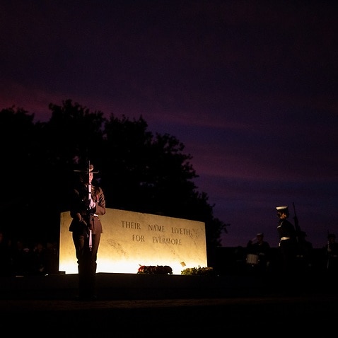 A supplied image obtained Monday, April 25, 2022, shows members of Australia's Federation Guard Catafalque party, stand guard over the Stone of Remembrance during the Anzac Day Dawn Service at the Australian War Memorial in Canberra. This Anzac Day will m