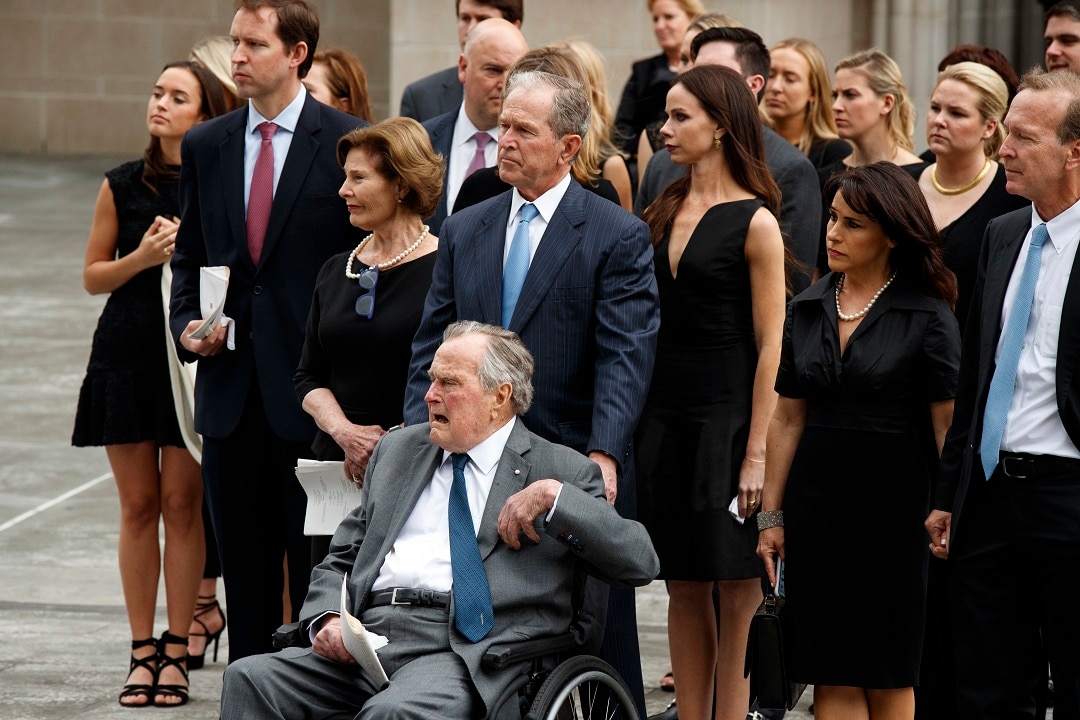 Former President George W. Bush and his father former President George H.W. Bush are joined by family and friends.