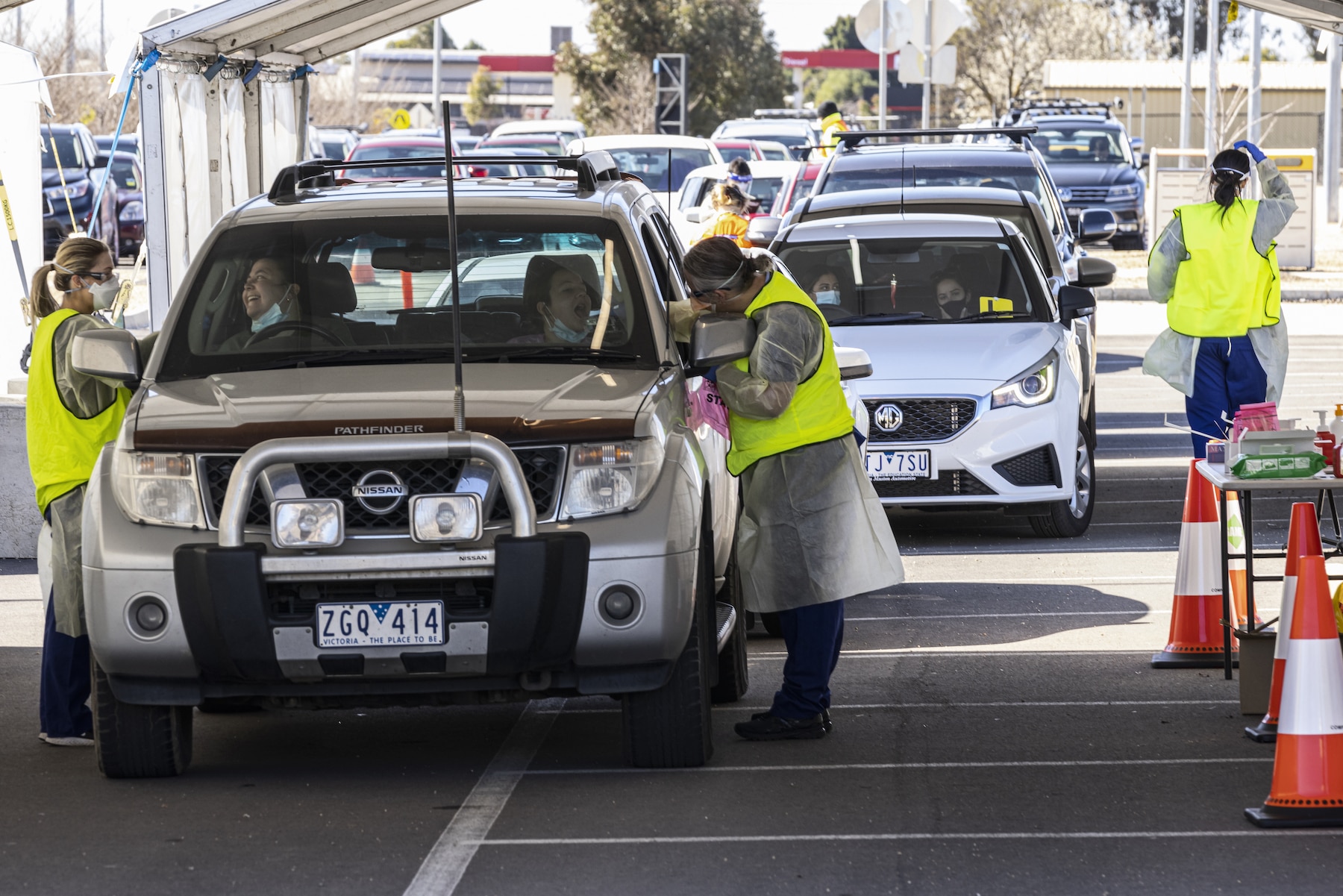 People queue in their cars for a COVID test at a drive-through testing site at Shepparton Sports Precinct in Shepparton, Victoria, Tuesday, August 24, 2021.