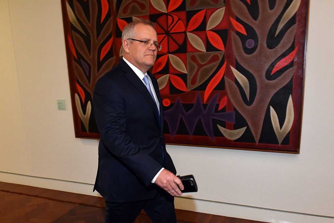 Australian Treasurer Scott Morrison arrives for the Liberal Party room meeting on Friday.