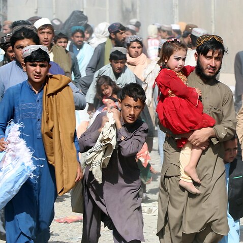 People move forward to cross into Pakistan at Pakistan-Afghanistan border in Spin Boldak, Afghanistan.