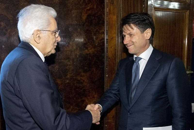 A handout photo made available by the Quirinal Press Office shows Giuseppe Conte (R) meeting with President Sergio Mattarella at the Quirinal Palace in Rome, Italy, 23 May 2018. 